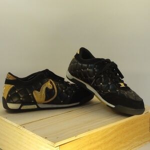 Size 7 Baby Phat sneakers, black with gold details